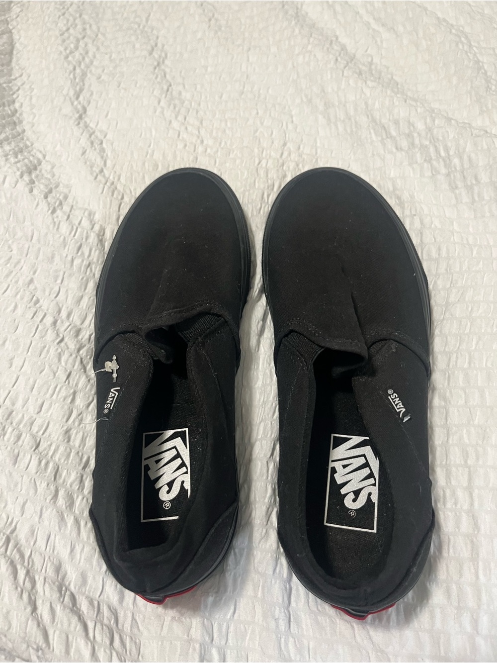 Vans Black Canvas Slip-On Sneakers with Red Heel Tab